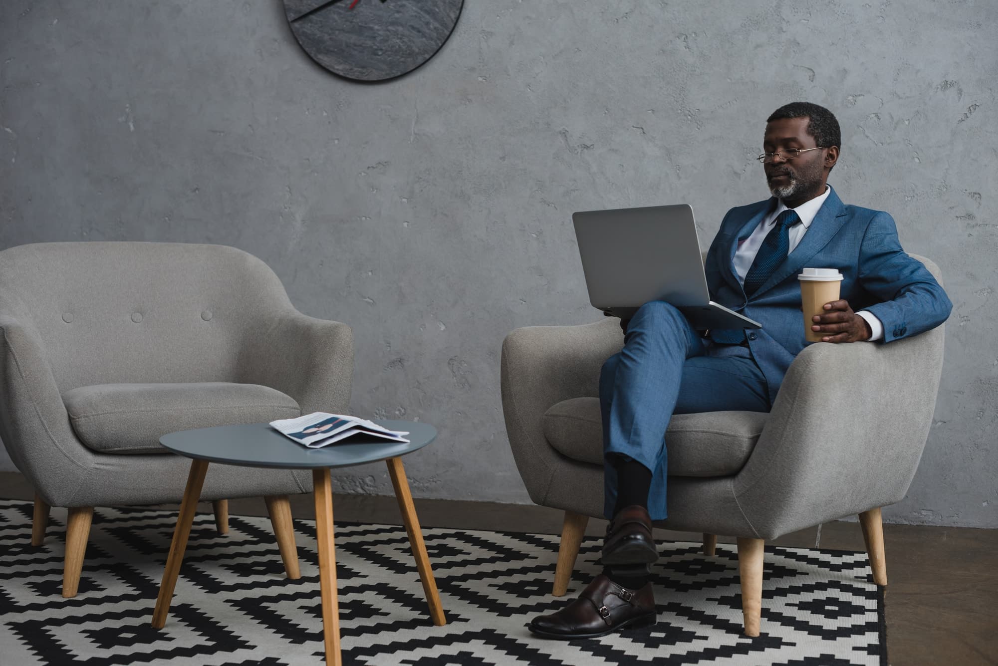 An adviser and client reviewing a wealth plan together
